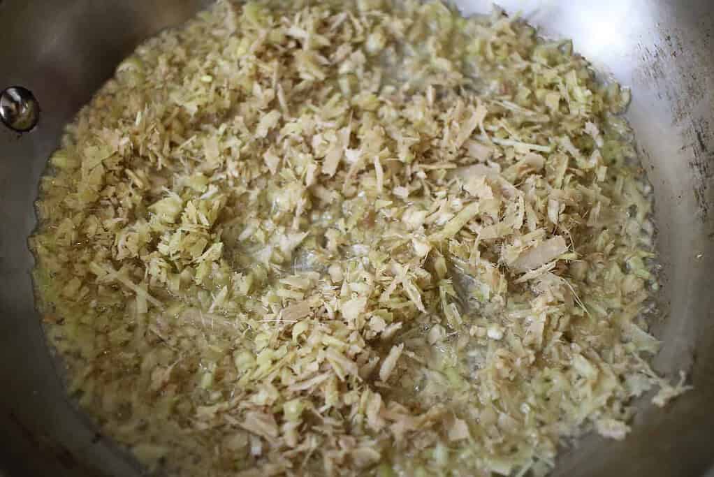 Chopped lemongrass frying in oil for Spicy Vietnamese Beef Noodle Soup (Bún bò Huế)