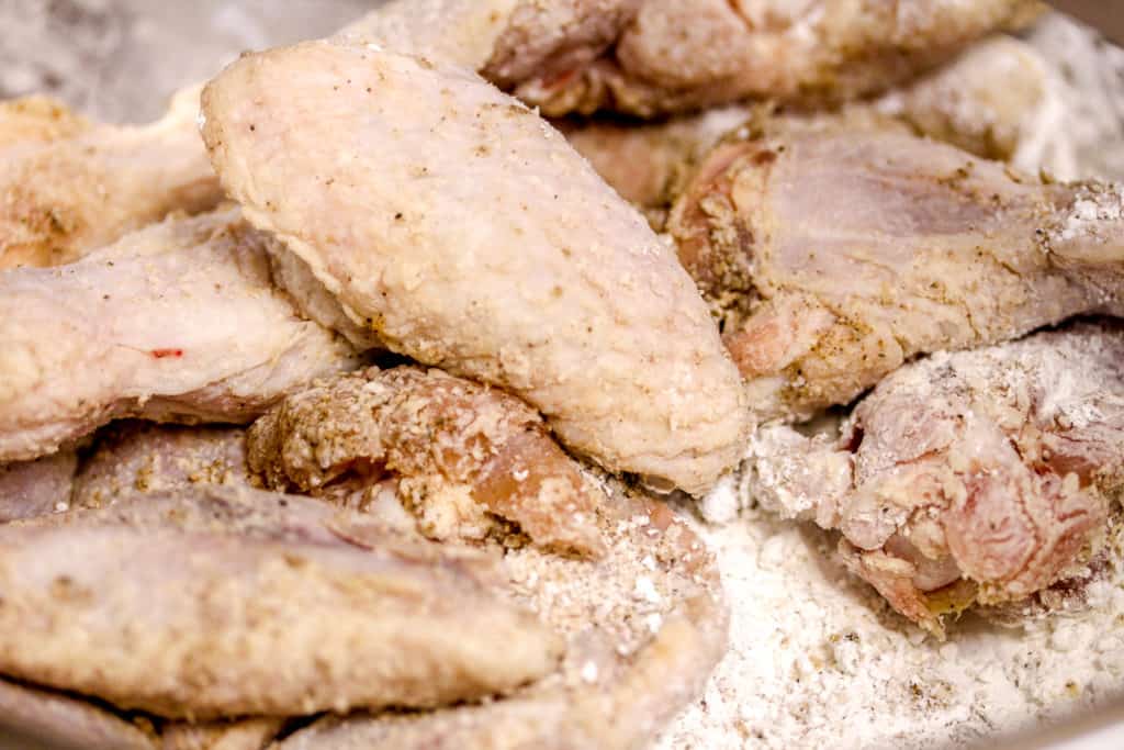 seasoned chicken wings coated in corn starch