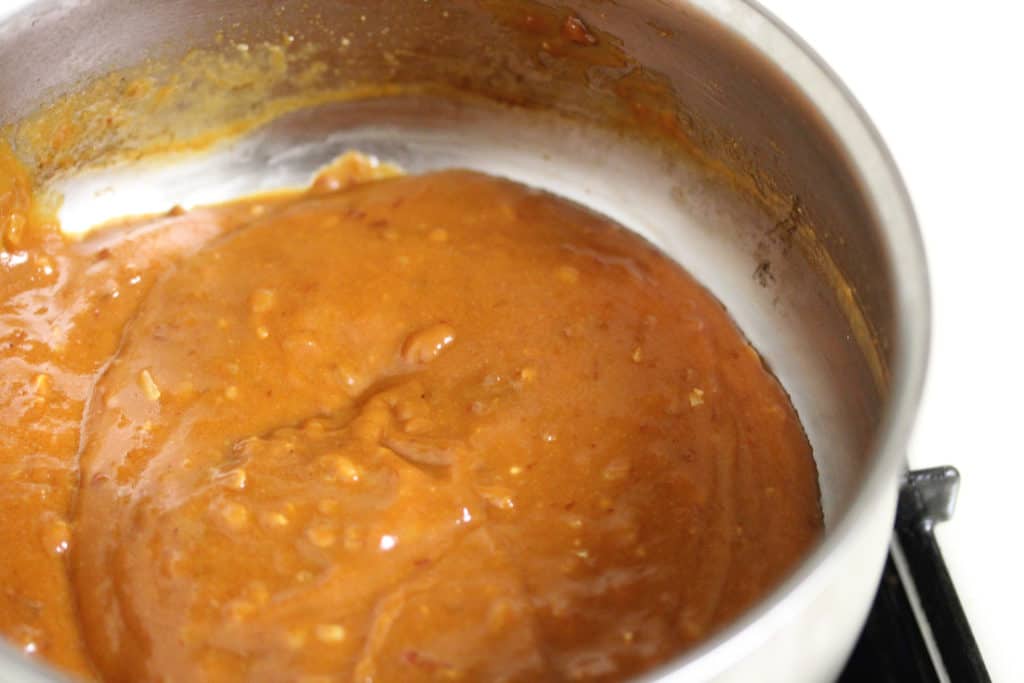 peanut sauce in a stainless steel saucepot