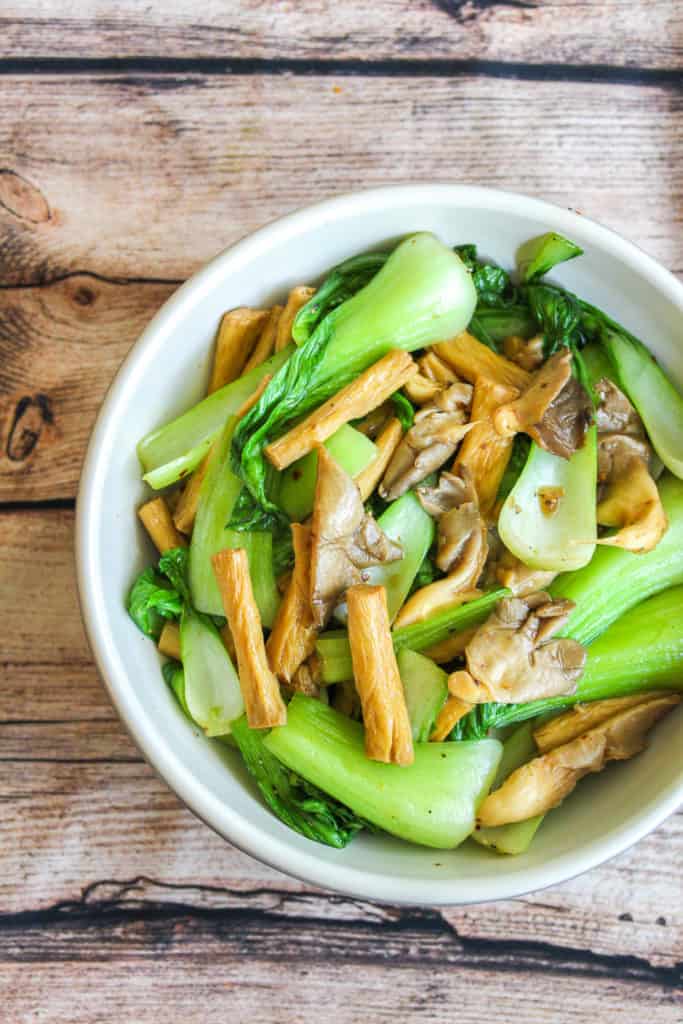 white bowl with tofu skin, bok choy and oyster mushrooms