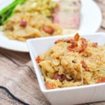 white square bowl with braised saurkraut and bacon