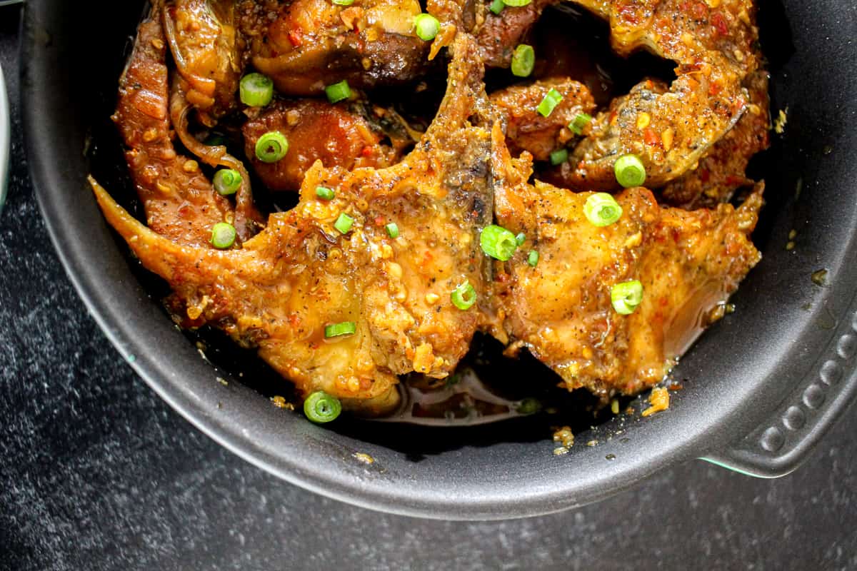 two catfish steaks are seen in a casserole dish