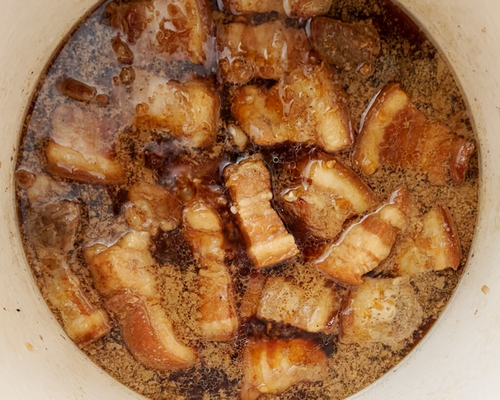 pork belly simmering in coconut water