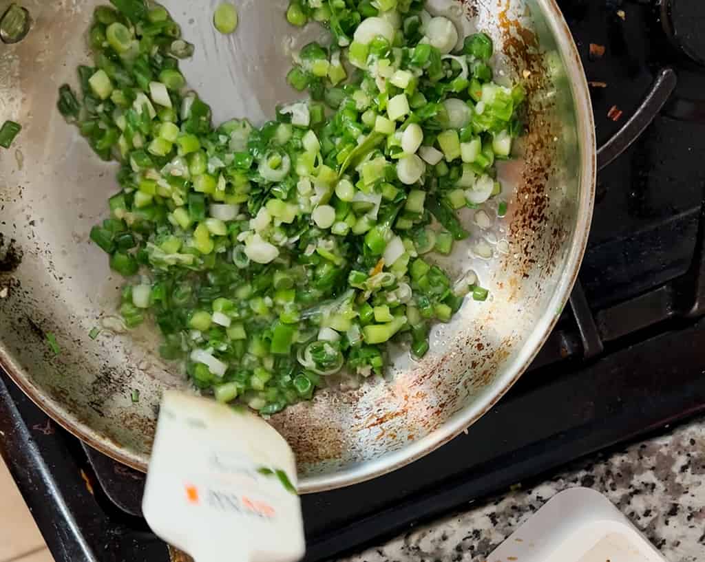Scallion oil in a stainless steel pan