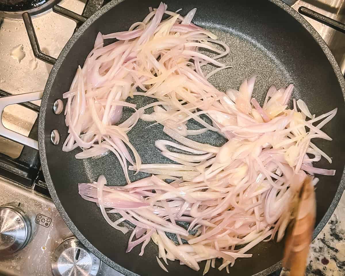 Sliced shallots in a pan