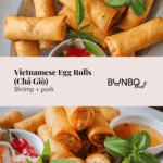 Pinterest graphic for Vietnamese Egg Rolls (Chả Giò) with shrimp and pork, showing crispy golden rolls served with herbs, pickled vegetables, and dipping sauce, branded with Bun Bo Bae logo and website.